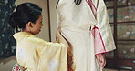 Women, seamstress and customer with kimono dress for fitting and traditional event in Japan. Fashion designer, client and tailor with fabric or clothes at workshop with creativity, textiles and style