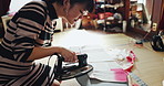 Woman, ironing and material for fashion with designer, manufacturing or production for tradition, culture and style. Japanese person, press and factory with fabric, inspection and clothes at workshop