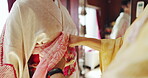 Fashion designer, woman and kimono dress in Japan with obi belt fitting, textile wrap or decorative accessory. Small business, hands of seamstress and tailor client clothing in workshop for tradition