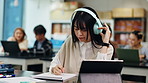 Tablet, university notes and headphones of woman with phd, study and thesis with app video. Study, writing and webinar with information for graduate and Japanese student research for elearning
