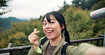 Influencer, hiking and face of Asian woman in nature on holiday, vacation or travel adventure. Content creator, mountain Takao and portrait of Japanese woman for talking, live streaming and recording