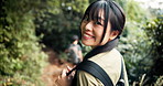 Nature, woman and face with fitness for hiking, wilderness adventure and trekking trail with smile. Japanese people, couple and partner in portrait for walking, backpack and wellness in Mount Fuji