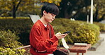 Japanese, man and typing with phone outdoor of communication, social media and texting contact. Male person, relax and mobile for networking, reading blog and location notification of travel in Japan