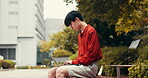Japanese, man and typing with laptop outdoor for education research, university application and studying. Student, online learning and feedback with assessment, information and scholarship in Japan