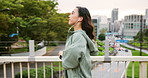 Running, cardio and woman with earphones, city and listening to music for exercise, athlete and Tokyo. Outdoor, fitness and streaming with app, runner and workout for Japanese person, audio and Japan