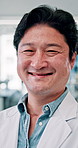 Japanese, doctor and man with portrait, smile and laughing in hospital with confidence. Healthcare, closeup and wellness employee from Japan with surgeon, pride and management of professional 