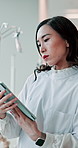 Reading, woman and doctor with tablet for search, planning or schedule review at Japanese university hospital. Thinking, scroll and healthcare professional on digital app for online medical report
