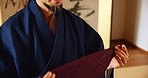Japanese, man and napkin for tea tradition with ceremony preparation, culture respect and hospitality. Male person, prepare and spiritual connection, heritage custom and indigenous practice in Japan