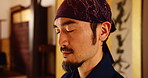 Man, peace and meditation in Japan for yoga, preparation and mindfulness. Japanese person, mature sensei or relax in martial arts dojo for spiritual wellness, calm or balance to align chakra with zen