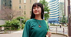 City, thinking and walking with Japanese woman outdoor for holiday, travel or vacation abroad. Journey, sightseeing and tourism with pedestrian person in urban town for adventure, break or trip