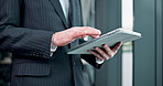 Man, hands and tablet in office for business, update schedule and planning in app. Trader, tech and scroll in Japanese agency for stock market research, investment opportunity and online banking
