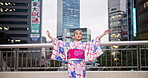 Culture, woman and dancing in fashion in city with hand movement, contemporary style or expression. Japanese person, creative dancer or nihon buyo in traditional kimono on outdoor bridge for heritage