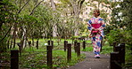 Japanese, kimono and girl walking in park of culture travel, indigenous clothes and nature sightseeing. Woman, vintage tradition and journey of spiritual vacation, morning view and history in Japan