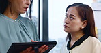 Business people, tablet and talk in office for advice, presentation feedback and workshop in Japan. Women, tech and discussion in Japanese company for development, mentoring and planning for growth