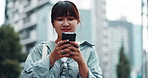 Japan, walking and city girl with smartphone, typing and urban town with email notification. Asian woman, outdoor and person with cellphone, travel or smile with online reading and message to contact