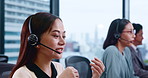 Asian woman, call center and consultant with headphones for customer service or telemarketing at office. Japanese, female person and agent with headset for telecommunications agency or online advice