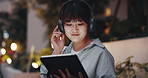 Woman, tablet and headphones at night in city with music, streaming or application on metro sidewalk. Girl, person and happy with digital touchscreen for audio, sound or subscription on road in Japan