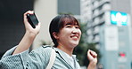 Japan, celebration and city girl with smartphone, excited and connection with email notification. Asian woman, outdoor and person with cellphone, travel or urban town with positive mindset or success