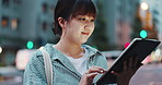 Woman, tablet and scroll at night in city with search for restaurant, landmark or adventure on street. Girl, person and happy with digital touchscreen for travel, location or booking taxi in Japan