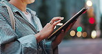 Hands, tablet and scroll at night in city with search for restaurant, landmark or adventure on street. Person, click and outdoor with digital touchscreen for travel, location or booking taxi in Japan