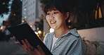 Woman, tablet and scroll at night in street with laughing, meme and funny post with adventure in city. Girl, person and happy with digital touchscreen for travel, application or social media in Japan