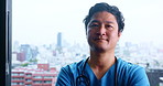 Japanese doctor, face and confidence for results, surgery or diagnosis in hospital as medic. Male person, portrait and pride for healthcare services, medicine or wellness in clinic with arms crossed