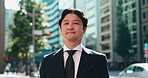 Japanese, businessman and face in city for travel, commute and walking in morning to workplace. Urban, mature employee and corporate lawyer with ambition for career, journey and outdoor trip in Tokyo