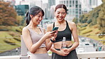 App, laughing and woman with Japanese women outdoor in city together for health, sports or wellness tracking. Exercise, funny and smile with athlete friends tracking training or workout progress