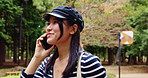 Japanese woman, walking and park with phone call for talking, communication and listening to contact. Nature, female person and happy with mobile for conversation, vacation update and travel outdoor
