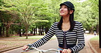 Walking, bike and thinking with Japanese woman in park for travel, carbon footprint and health. Reflection, transportation and peace with asian person and bicycle in nature for cycling and wellness
