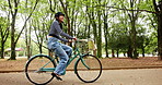 Japanese woman, bike and travel at park outdoor for health, wellness and trip. Bicycle ride, cycling and happy female person at garden for journey, commute and exercise with eco friendly transport