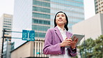 Tablet, thinking or Asian woman in city for walking, research or real estate agent at office buildings. Smile, businesswoman or realtor on app for online listing, ideas or urban development.in Japan