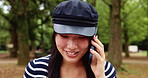 Japanese woman, smile and talking with phone call in park, communication and listening to contact. Nature, female person and student with mobile for conversation, education update and travel outdoor