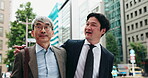 Business people, walking and hug in city for collaboration, discussion and communication with commute to work. Lawyer, talking and legal company in urban town for partnership, mentor or team in Japan