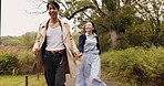 Holding hands, running and love with Japanese couple in park for trust, partner and bonding together. Commitment, freedom and happy with asian man and woman on date for care, honeymoon and vacation