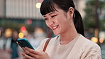Professional, woman and laughing with phone in city for funny text message and social media meme at night. Japanese person, smartphone and happy outdoor for mobile chat, internet joke or dating site