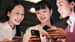 Japanese women, phone and city for night travel with social media, happy news or information. Friends, talk and laughing with smartphone for networking, funny meme or train schedule search in Tokyo