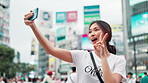 Happy, asian woman and selfie with peace sign in city for photography, memory or picture in Tokyo. Japanese, female person or vlog with smile or emoji for capture, moment or travel in an urban town