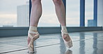 Pointe shoes, legs and ballerina in studio for stretching with rehearsal, practice or performance. Creative, feet and closeup of classical dancer with warm up for recital, ballet or concert in class.