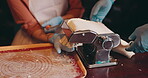People, hands and pasta machine in class for cooking, learning and help in Japanese restaurant. Couple, support and ramen making at course for skill development, traditional meal or culture education
