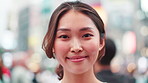 Face, Japanese and woman with smile in city for travel, tourist location and journey for culture vacation. Happy, person and commute of urban morning, holiday and sightseeing for destination in Japan