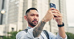 Asian man, selfie and picture with city for travel, memory or photography in an urban town. Japanese, male person or young tourist with smile or online app for capture, moment or sightseeing in Japan