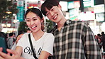 Happy, asian couple and night with selfie in city for memory or picture together in Tokyo. Japanese, man and woman with smile for photography, moment or late evening bonding in an urban town of Japan