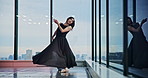Woman, ballet and dancing at window with performance, elegance or talent audition. Japanese dancer, movement and creative in studio with artistic expression, routine rehearsal or culture choreography