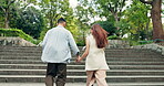 Couple, running and holding hands in park for love, bonding or connection with romance, back or support. Man, woman and adventure outdoor for relationship, travel or tourism with fun holiday in Japan