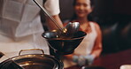 Hands, Japanese man and woman with hotpot for healthy meal, food and traditional cuisine as couple. People, serving and ramen noodles as culinary culture, dinner or preparing dish in Asian restaurant