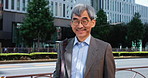 Mature man, face and happy in Japan for education, knowledge and career development in city. Professor, glasses and portrait at Tokyo university with positivity, pride and opportunity for growth