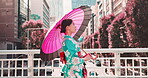 Woman, kimono and walking with umbrella in town, outdoor bridge and travel on weekend for peace. Female person, traditional clothes and profile in city for culture, local fashion and exploring urban