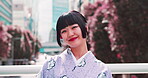 Smile, face and kimono with Japanese woman in park for traditional festival, hanami and spring. Cherry blossom, peace and culture with portrait of asian person for fashion, heritage and yukata