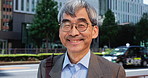 Mature man, face and smile in Japan for education, knowledge and career development in city. Professor, glasses and portrait at Tokyo university with surprise, news or exciting opportunity for growth